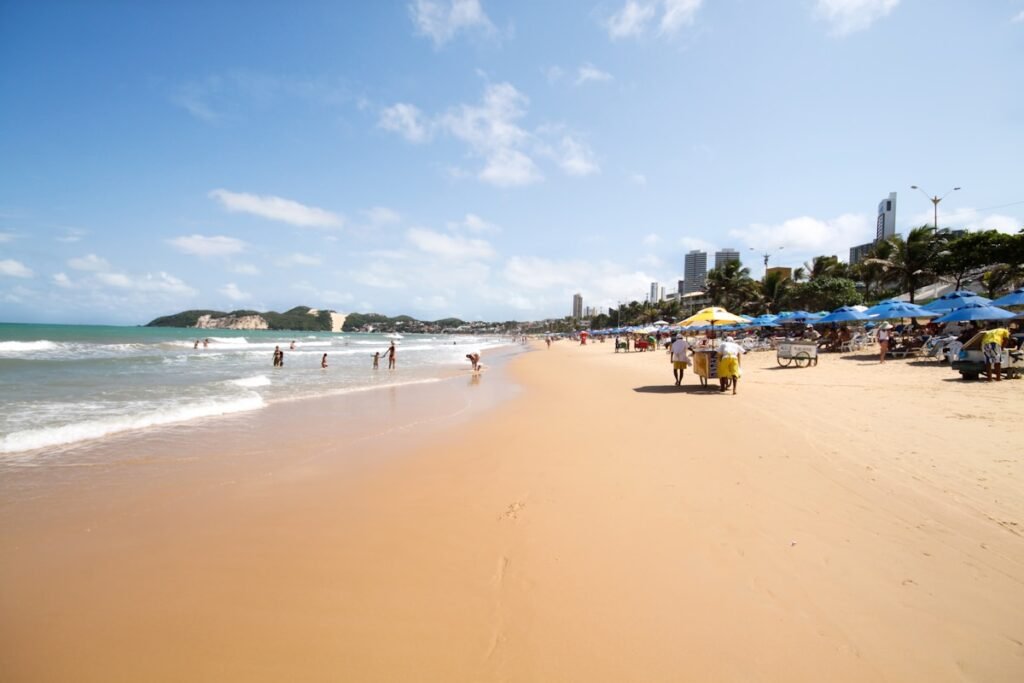 people on beach during daytime in Natal