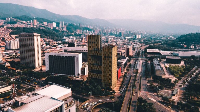 an aerial view of a Medellín city with tall buildings