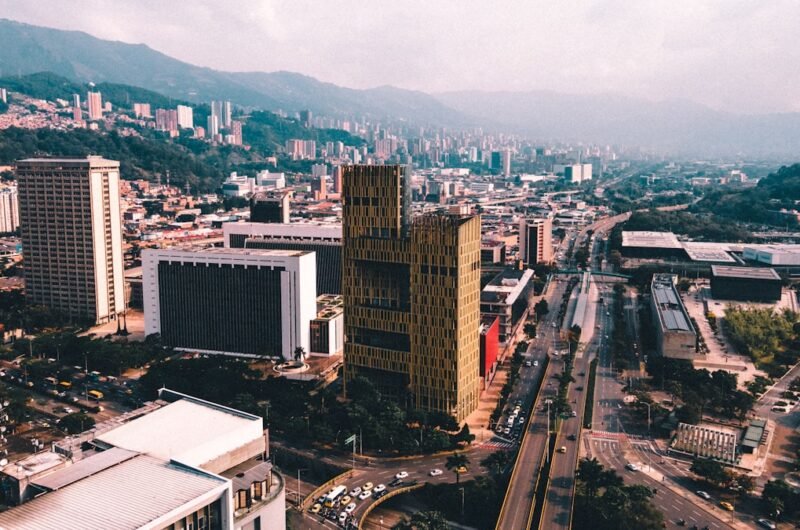 an aerial view of a Medellín city with tall buildings