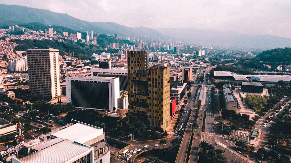 an aerial view of a Medellín city with tall buildings