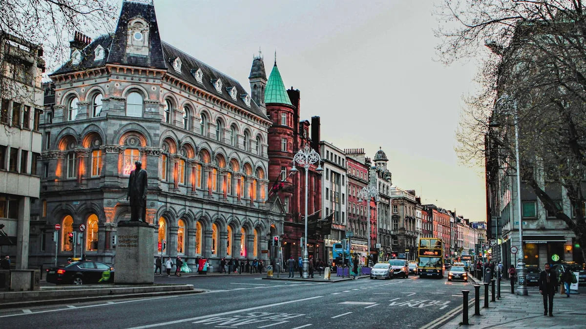a city street with a clock tower in the middle of it in Dublin