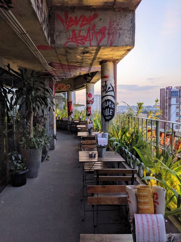 brown wooden table rooftop restaurants in el poblado medellin